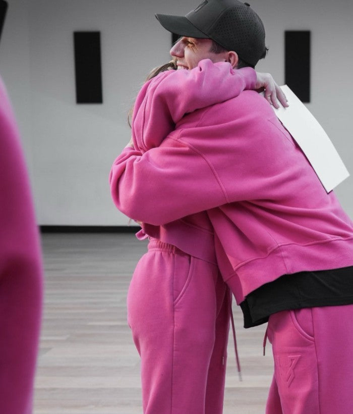 Pink Vertex tracksuit worn at a dance event